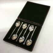A cased set of silver nail top coffee spoons. Lond