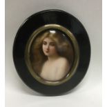 An oval miniature of a lady with wavy hair in bras