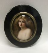 An oval miniature of a lady with wavy hair in bras