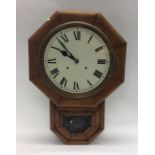 A mahogany cased clock with white enamelled dial.