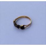 An Antique garnet four stone ring in gold mount. A