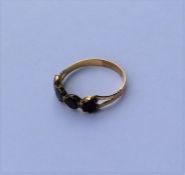 An Antique garnet four stone ring in gold mount. A