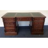 A large mahogany reproduction partners' desk with