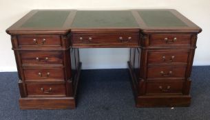 A large mahogany reproduction partners' desk with