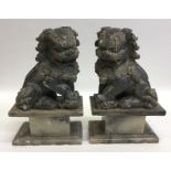 Two hard stone Dogs of Foo. Est. £20 - £30.