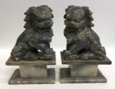 Two hard stone Dogs of Foo. Est. £20 - £30.