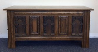 A small oak panelled coffer with hinged top. Est.