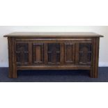 A small oak panelled coffer with hinged top. Est.