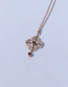 A garnet and pearl pendant on fine link chain. App