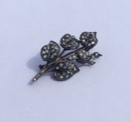 A large rose diamond brooch in the form of a leaf.