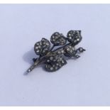 A large rose diamond brooch in the form of a leaf.