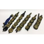 A large quantity of old horse brasses on leather m