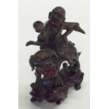 An unusual bronze figure of a Japanese Immortal on