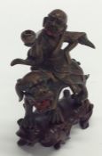 An unusual bronze figure of a Japanese Immortal on