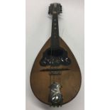 An olive wood and MOP inlaid mandolin. Est. £30 -