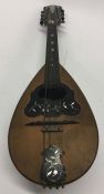 An olive wood and MOP inlaid mandolin. Est. £30 -