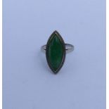 A large jade marquise shaped ring in white gold cl