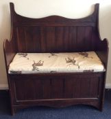 An oak panelled hinged top coffer. Est. £30 - £50.