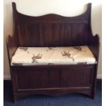 An oak panelled hinged top coffer. Est. £30 - £50.