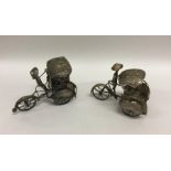 A pair of Continental silver rickshaws. Approx. 13