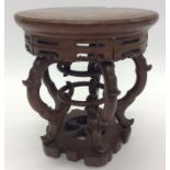 A carved Oriental hardwood vase stand. Approx. 22