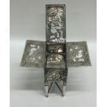 A novelty silver stamp box in the form of a table,