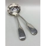 EXETER: A pair of silver fiddle pattern sauce ladl