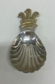 An unusual cast silver and silver gilt caddy spoon