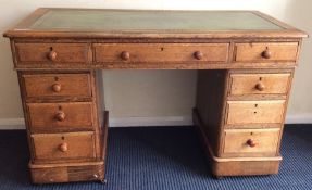 An oak seven drawer twin pedestal desk. Est. £50 -