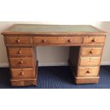 An oak seven drawer twin pedestal desk. Est. £50 -