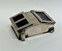 A novelty double sided stamp box with hinged top o