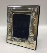 A rectangular silver child's picture frame decorat