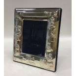 A rectangular silver child's picture frame decorat