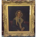 A large gilt framed portrait of a lady. Oil on can