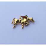 LACLOCHE: An 18 carat gold brooch in the form of a