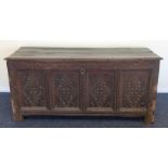 An Antique oak four panel coffer with plank top. E