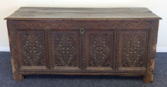 An Antique oak four panel coffer with plank top. E