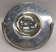 A large Colonial ? silver strainer with swing hand