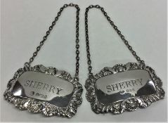 A pair of silver sherry labels. London. By FH. App