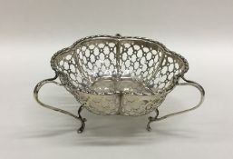 An Edwardian pierced silver bonbon dish with shape