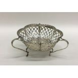 An Edwardian pierced silver bonbon dish with shape