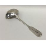 EXETER: A silver fiddle pattern sauce ladle. By J