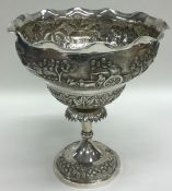 A large tall Indian silver sweet dish decorated wi