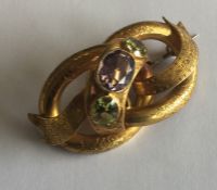 A massive amethyst and peridot Victorian brooch in