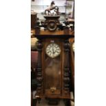A mahogany cased wall clock with white enamelled d
