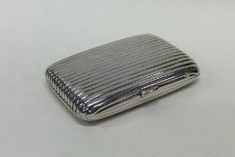 A heavy silver fluted cigarette box with hinged to