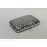 A heavy silver fluted cigarette box with hinged to