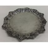 A circular silver pie crust waiter. London. By MJ. Approx. 22 cms