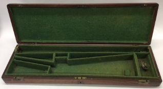 An Antique mahogany shotgun case with brass handle