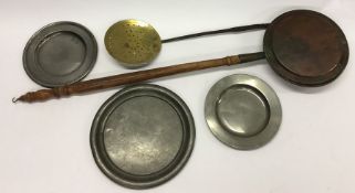 A copper warming pan together with two Antique pew